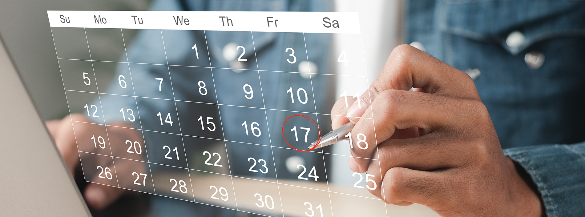 A person s hand holding a stylus over a digital calendar on a tablet, with the date circled and the month of June highlighted.