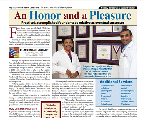 The image is a screenshot of a newspaper article titled 'An Honor and a Pleasure' featuring two individuals in lab coats, with one person standing behind the other.