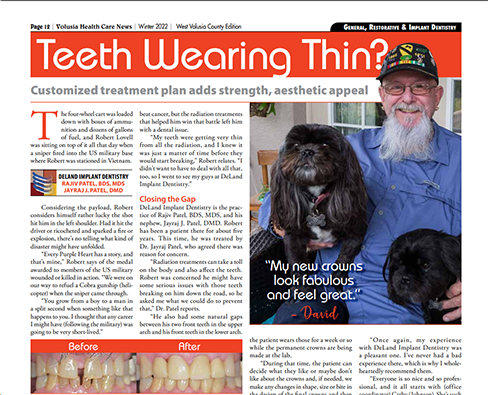 The image is a screenshot of a newspaper article with a headline that reads  Teeth Wearing Thin   and includes a photo of a man wearing a beard and a hat, sitting next to two dogs.