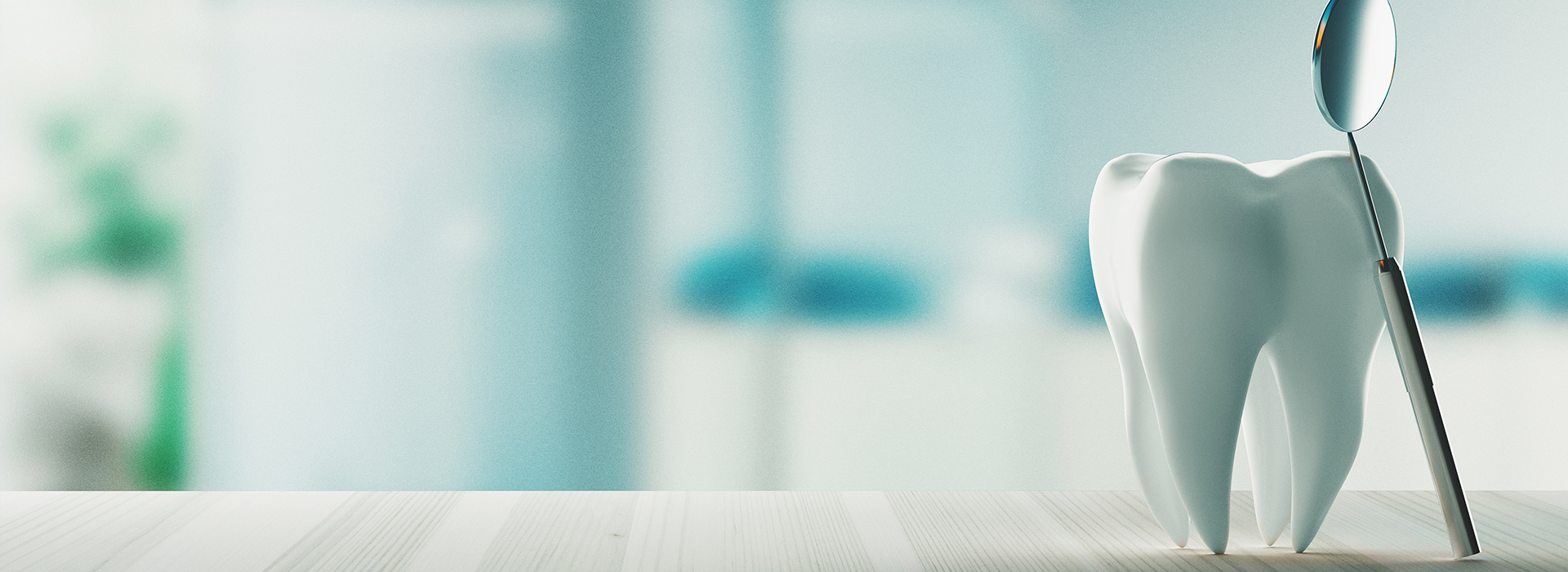 The image shows a white toothbrush with bristles, placed on a countertop in front of a blurred background.